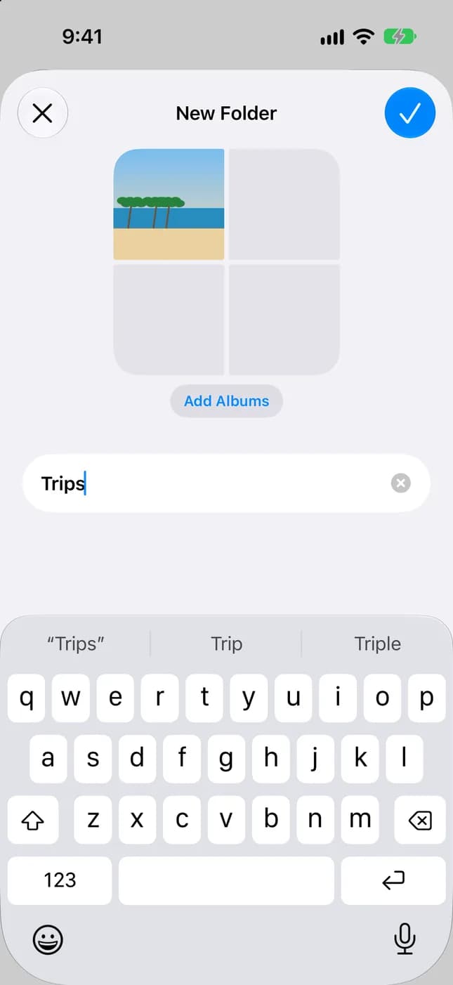 Bilder-skärmen Ny mapp med ett album tillagt i en mapp på iPhone